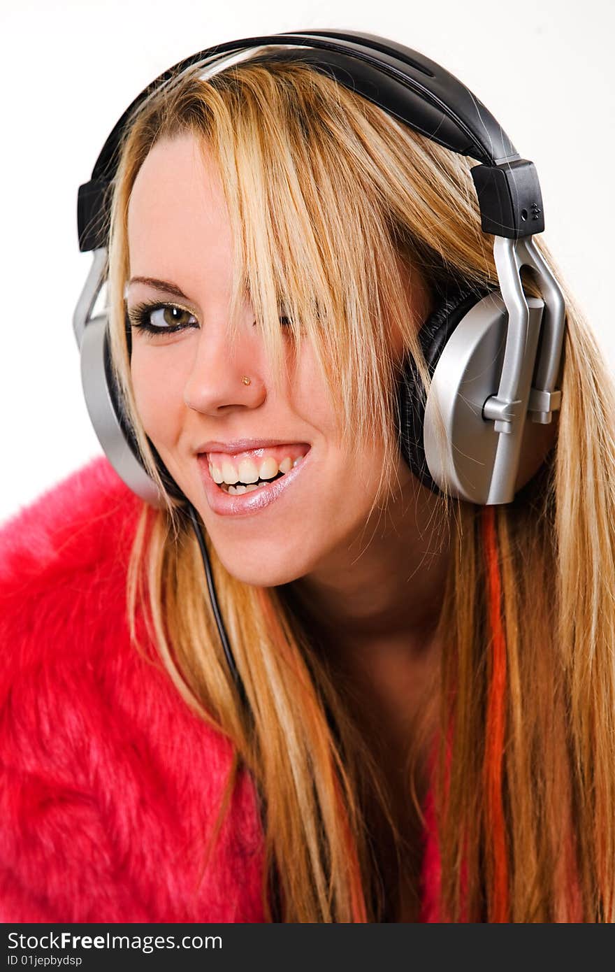 Attractive young girl with headphones over white background. Attractive young girl with headphones over white background