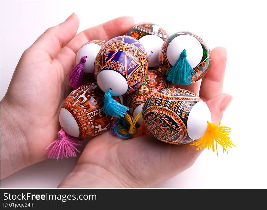 Colorful Easter Eggs In Palms, Isolated.