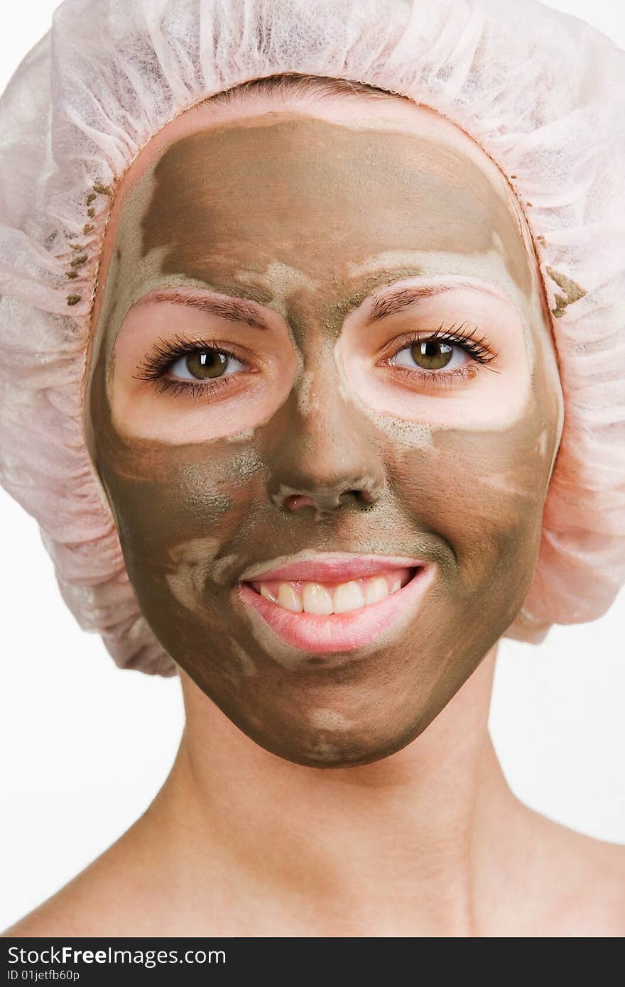 Young healthy woman with facial mask