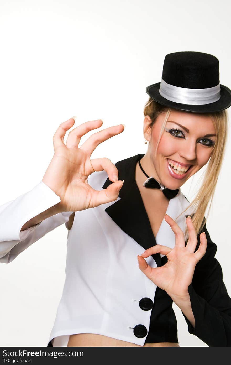 woman with small top hat making 'ok' gesture. woman with small top hat making 'ok' gesture