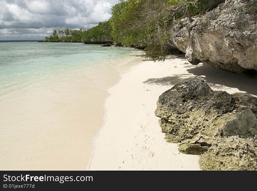 Beautiful white sand and clear water a perfect tropical beach setting. Beautiful white sand and clear water a perfect tropical beach setting