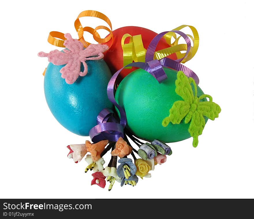 Three easter eggs with 	
butterflys and 	
flowers on a white background