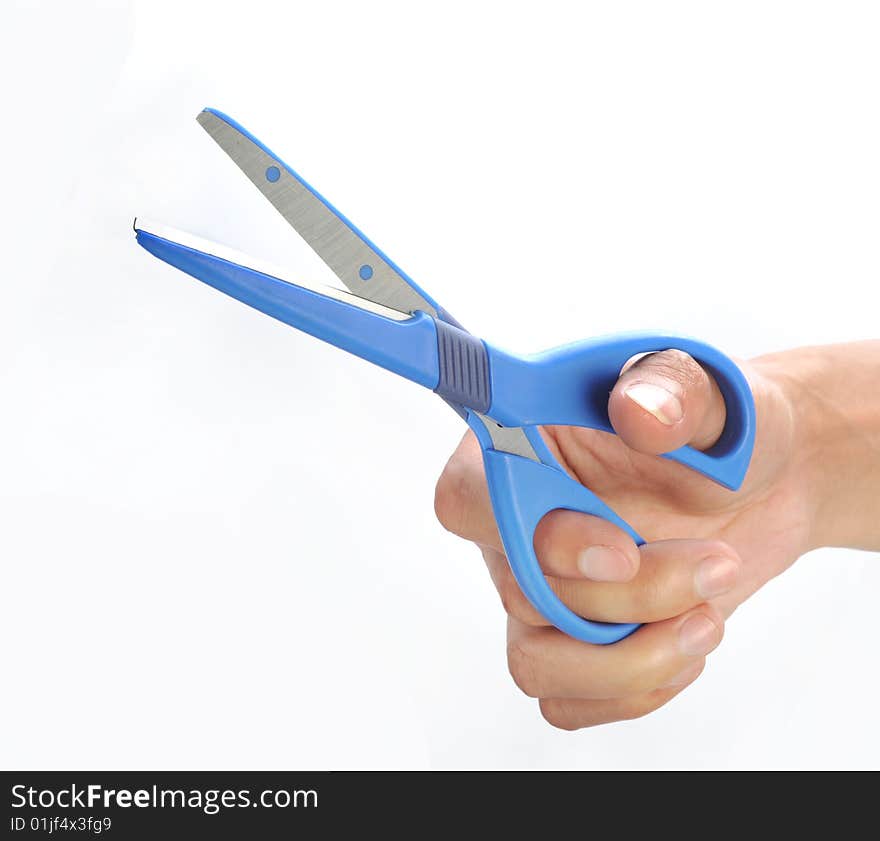 Hand holding scissors