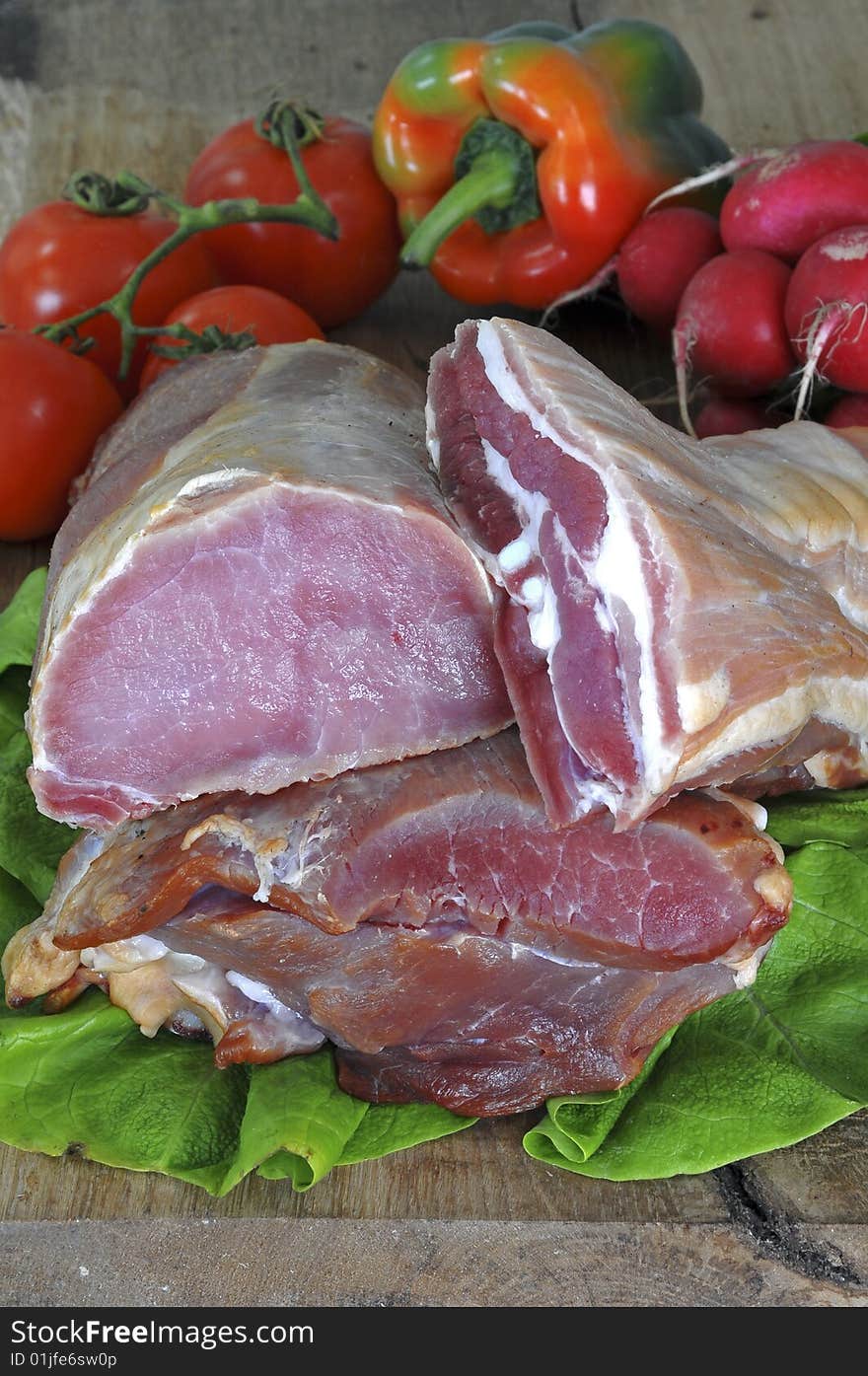 Fresh meat and vegetables on cutting board