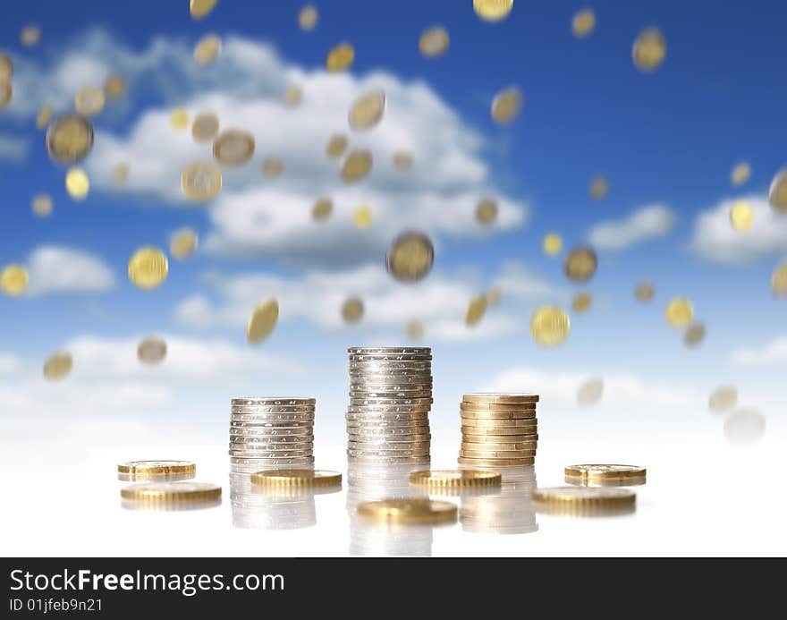 Coins over black background. Reflection in the table.