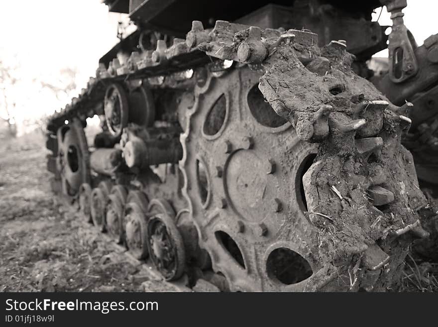 An old farm tractor on the side of an agriculture field in Ukraine. An old farm tractor on the side of an agriculture field in Ukraine