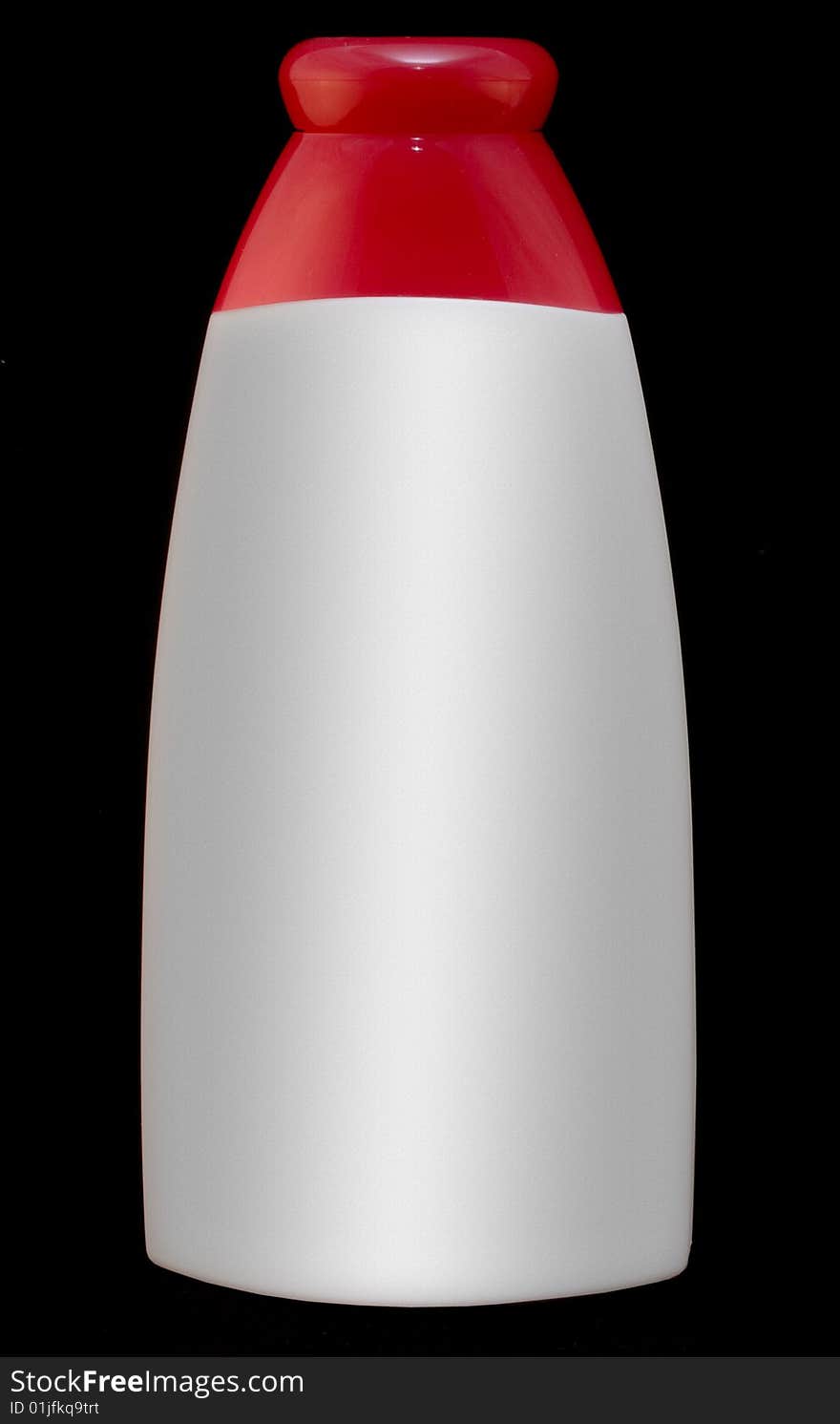 White bottle with red top on black