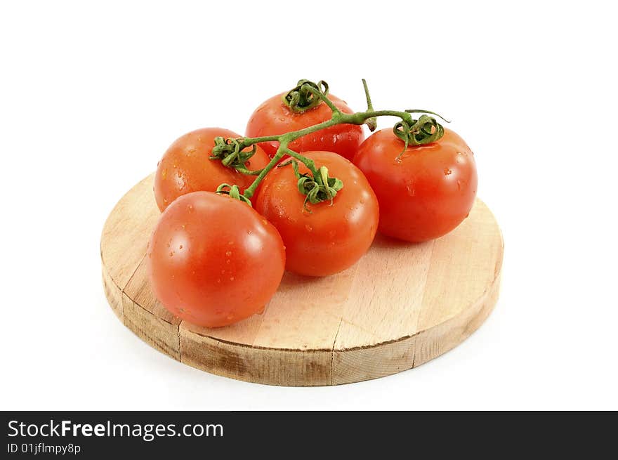 Five tomato on chopping board