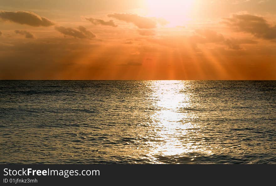 Beautiful sea tide in sunset with pink clouds. Beautiful sea tide in sunset with pink clouds