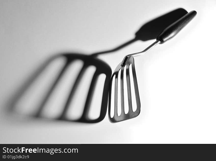 Kitchen shovel and her shade on a white background. Kitchen shovel and her shade on a white background