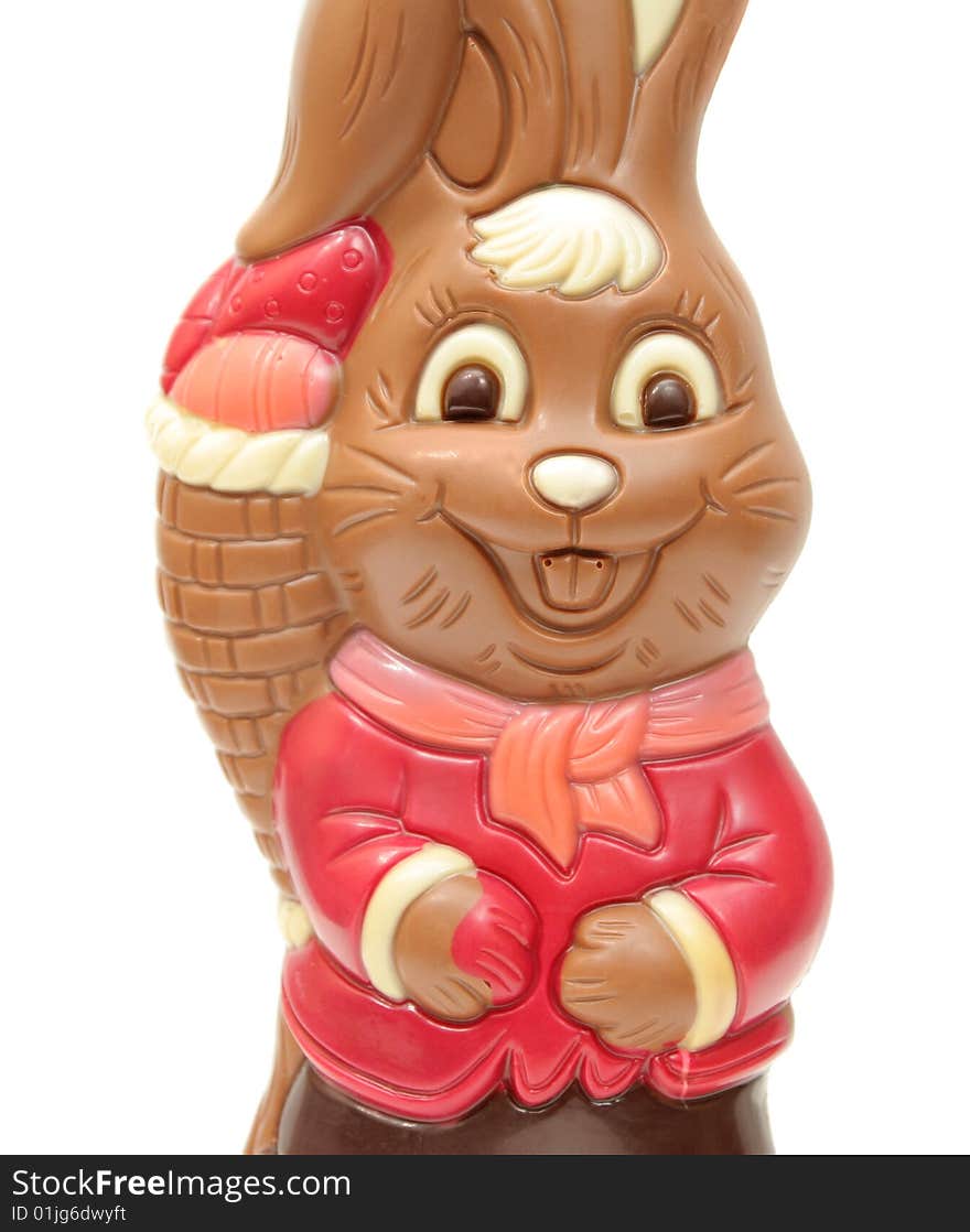 Chocolate happy Easter bunny carrying egg