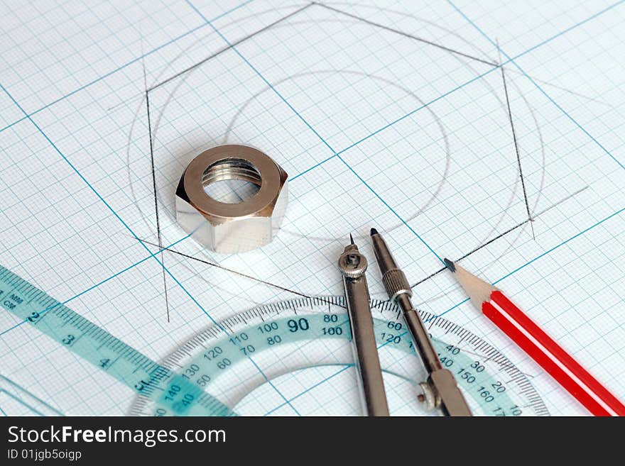 Drawing tools lying on background with graph paper. Drawing tools lying on background with graph paper