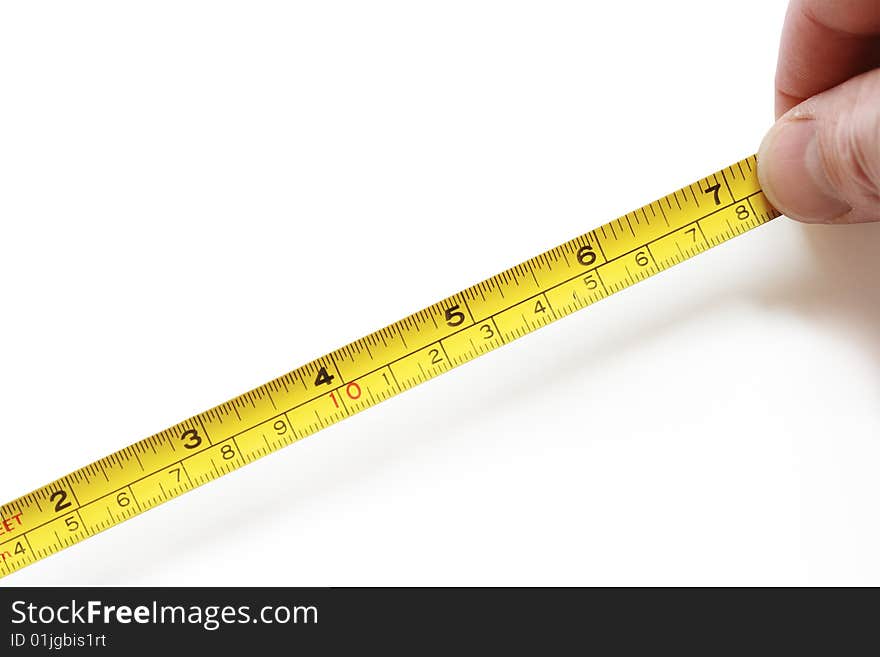 Man hand with yellow tape measure isolated on white background