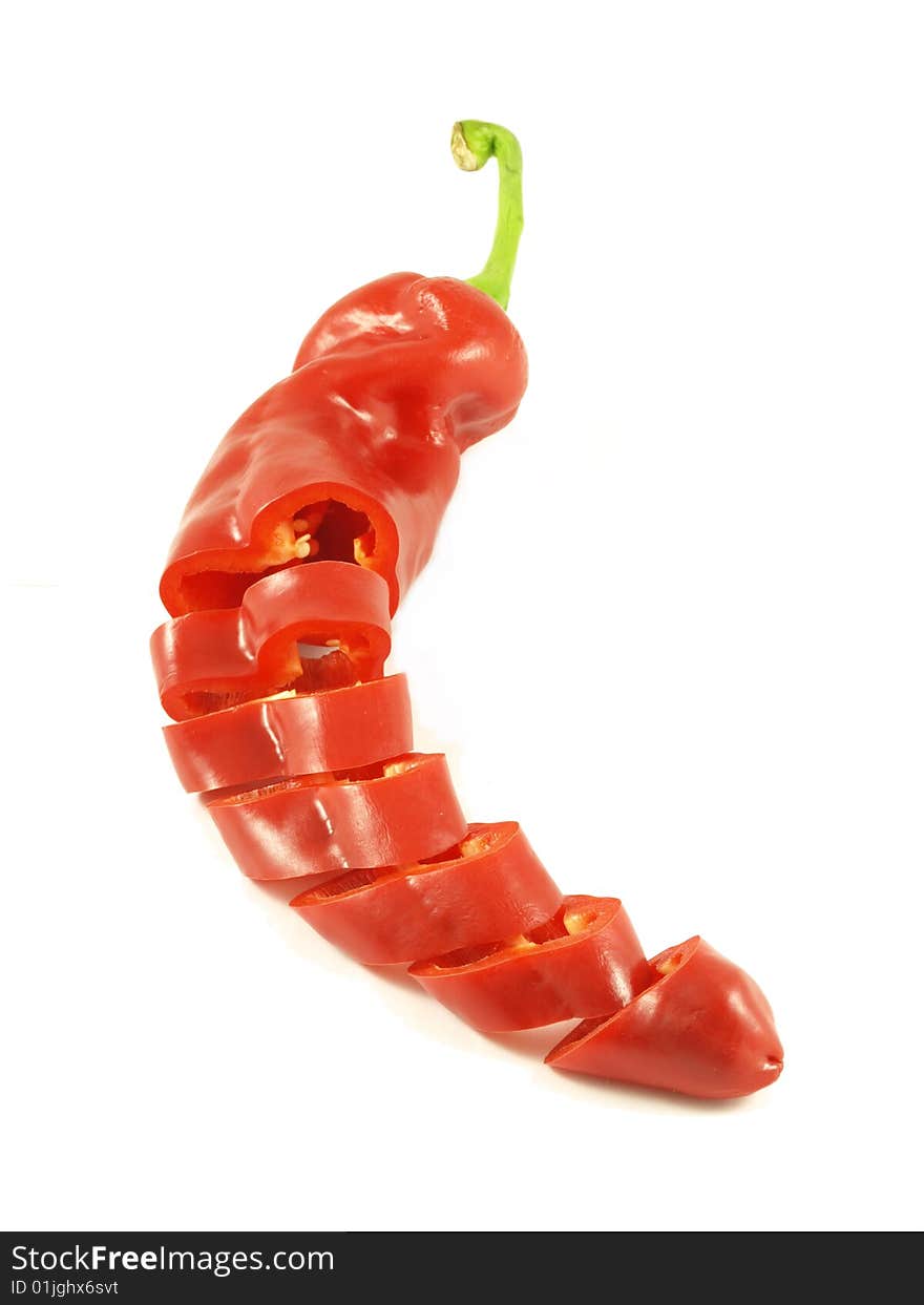 Red sliced chili pepper on isolated background. Red sliced chili pepper on isolated background.