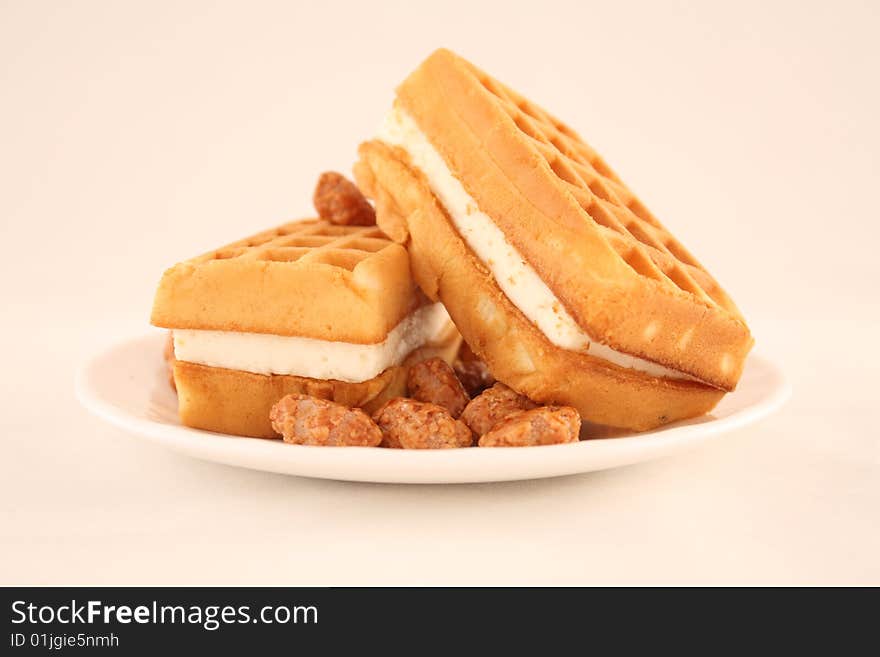 Wafers with a peanut in sugar lie on a plate