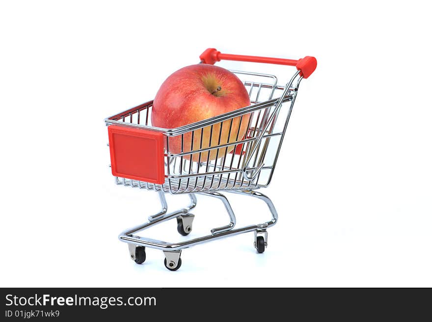 Apple in shopping basket isolated