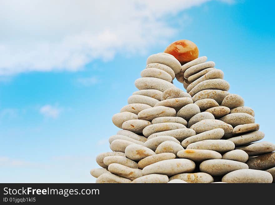 Pyramid from a pebble against the blue sky. Pyramid from a pebble against the blue sky