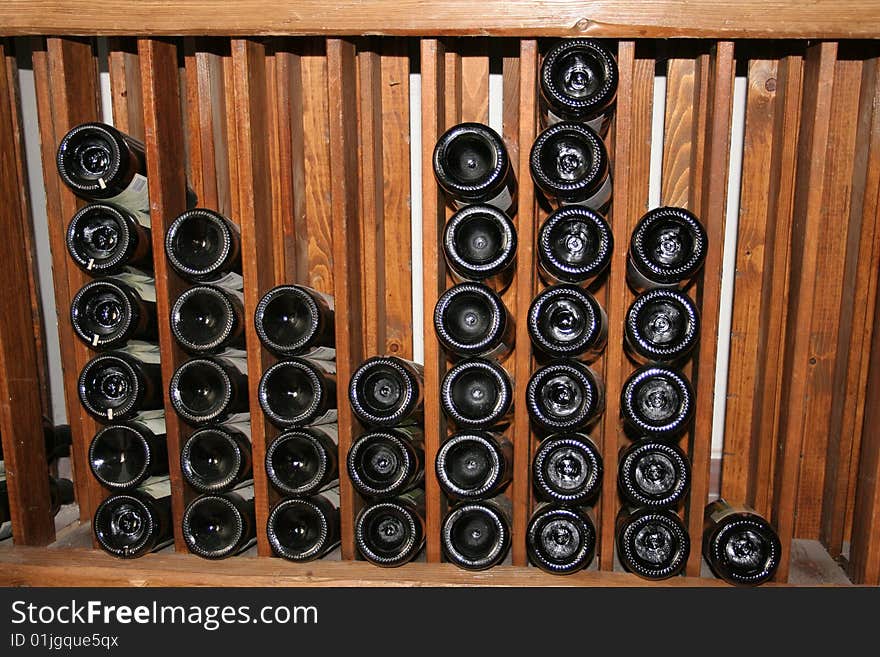 Wooden rack with bottles of wine. Wooden rack with bottles of wine