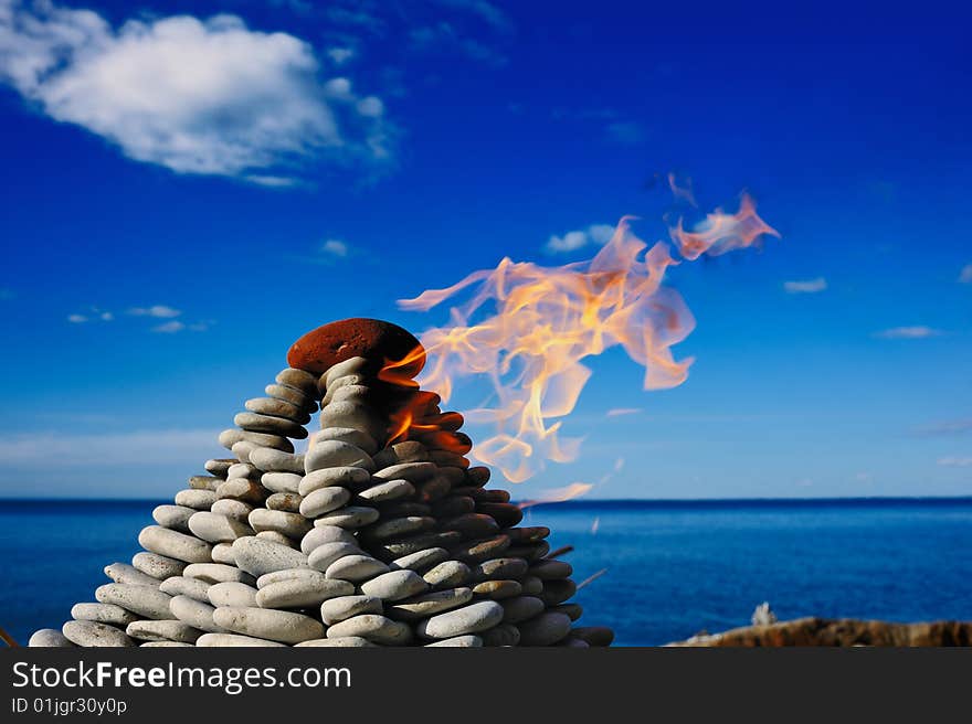 Signal Light at top of a pyramid from pebble. Signal Light at top of a pyramid from pebble