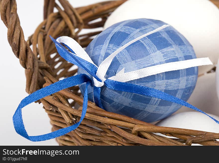 Easter eggs in a basket - blue egg