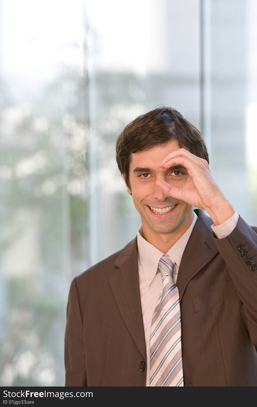 Portrait of young confident business man in focus. Portrait of young confident business man in focus.