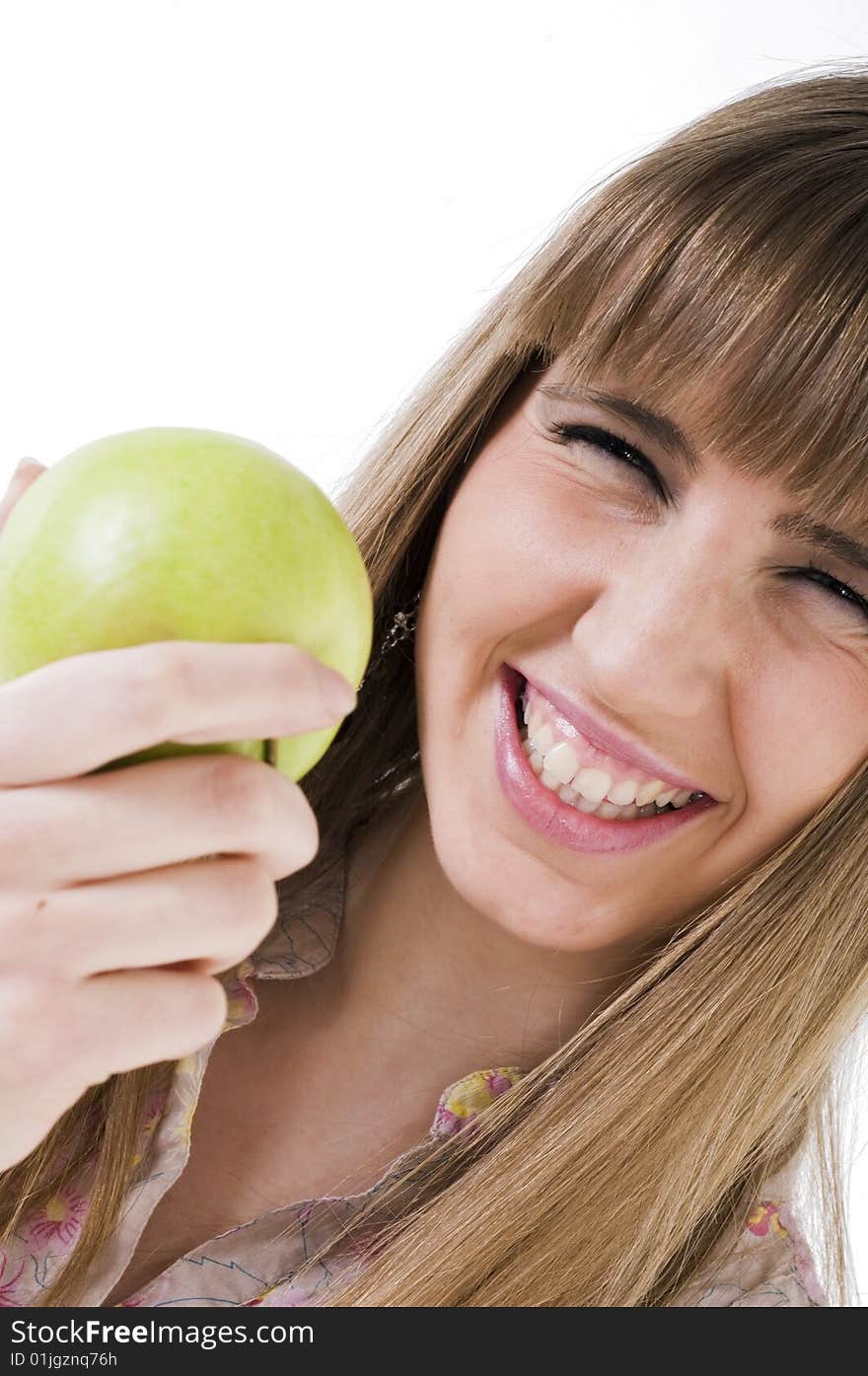 Young blue eyes girl with green apple. Young blue eyes girl with green apple.