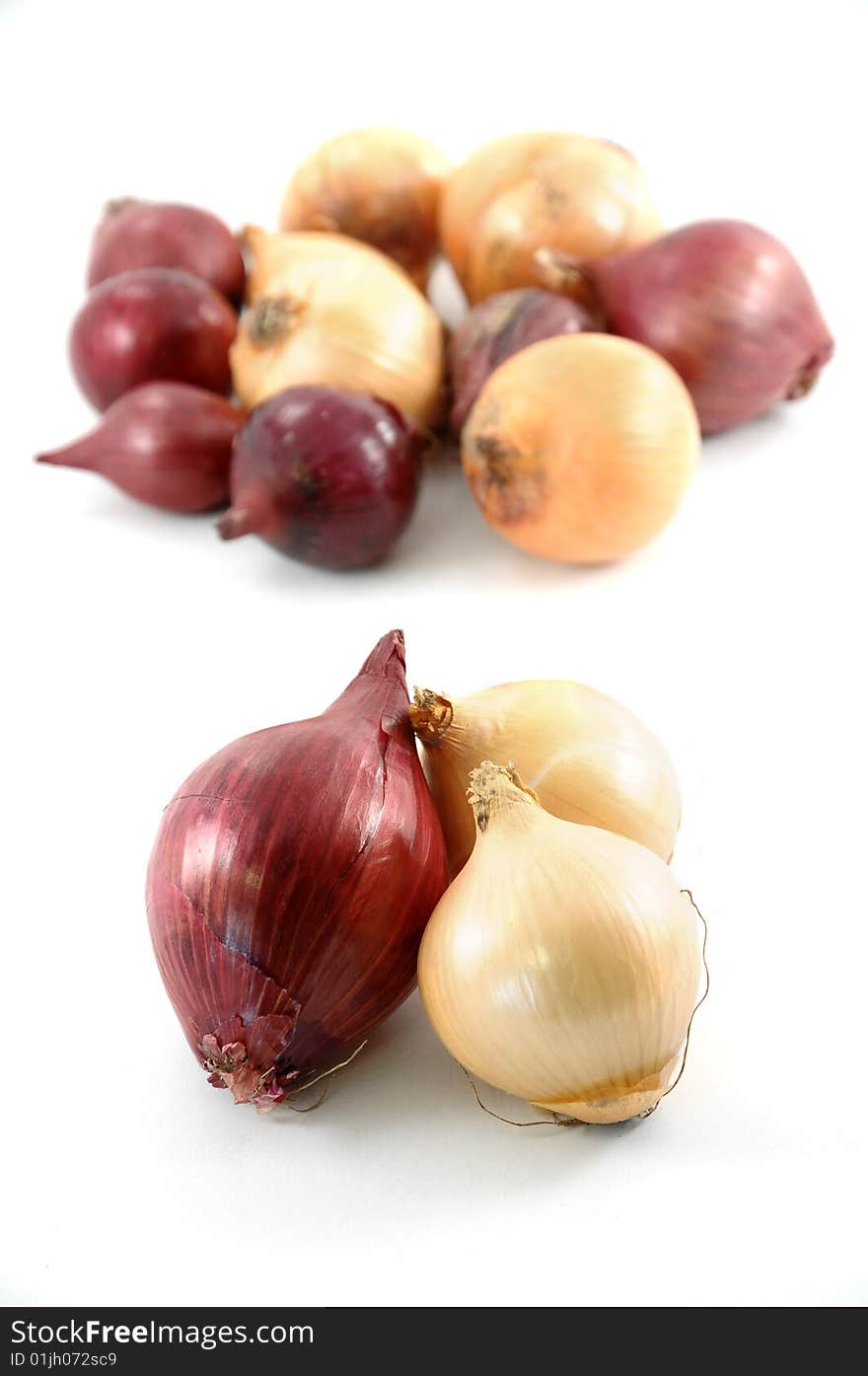 Red and yellow onion on white background