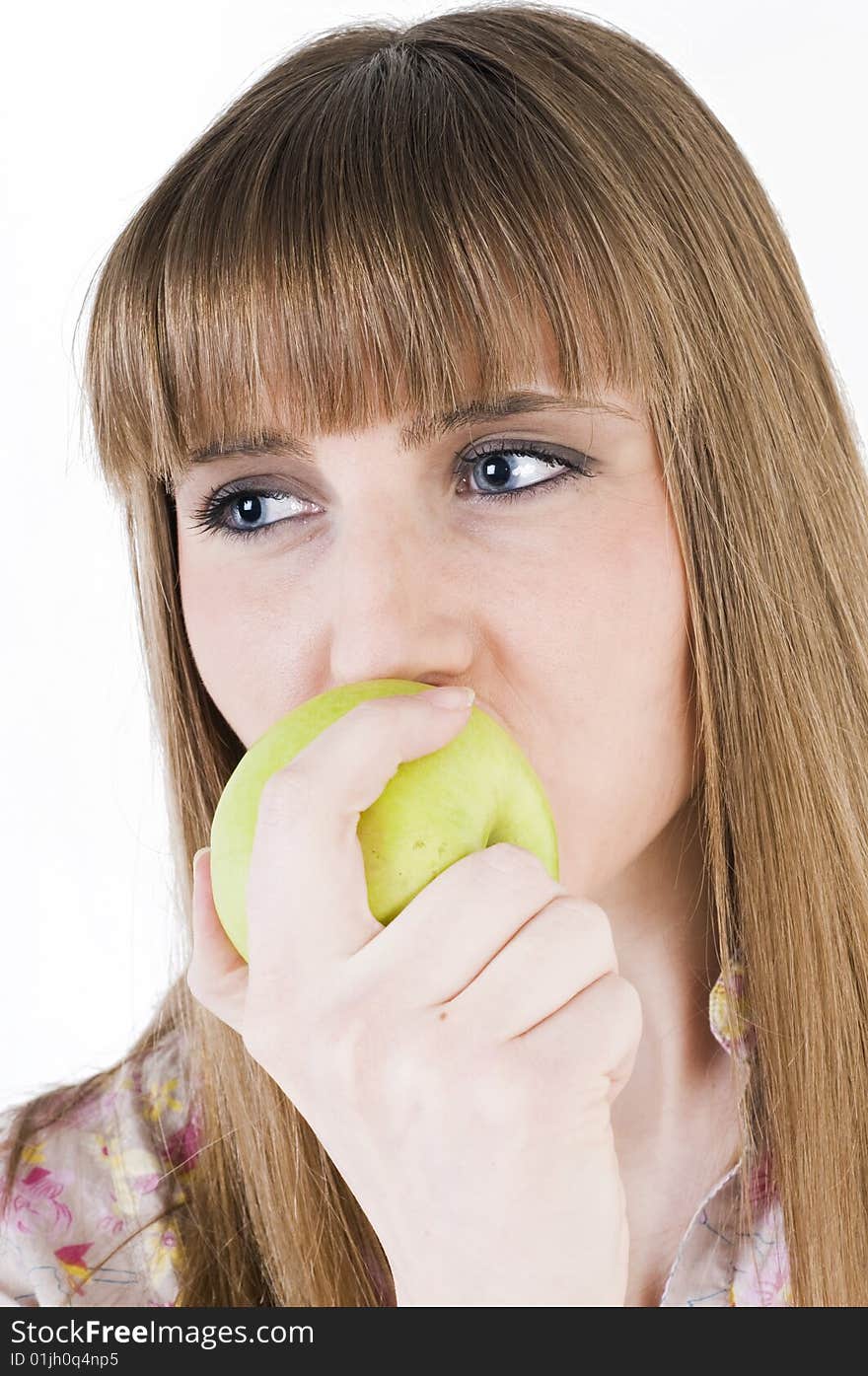 Young blue eyes girl with green apple. Young blue eyes girl with green apple.