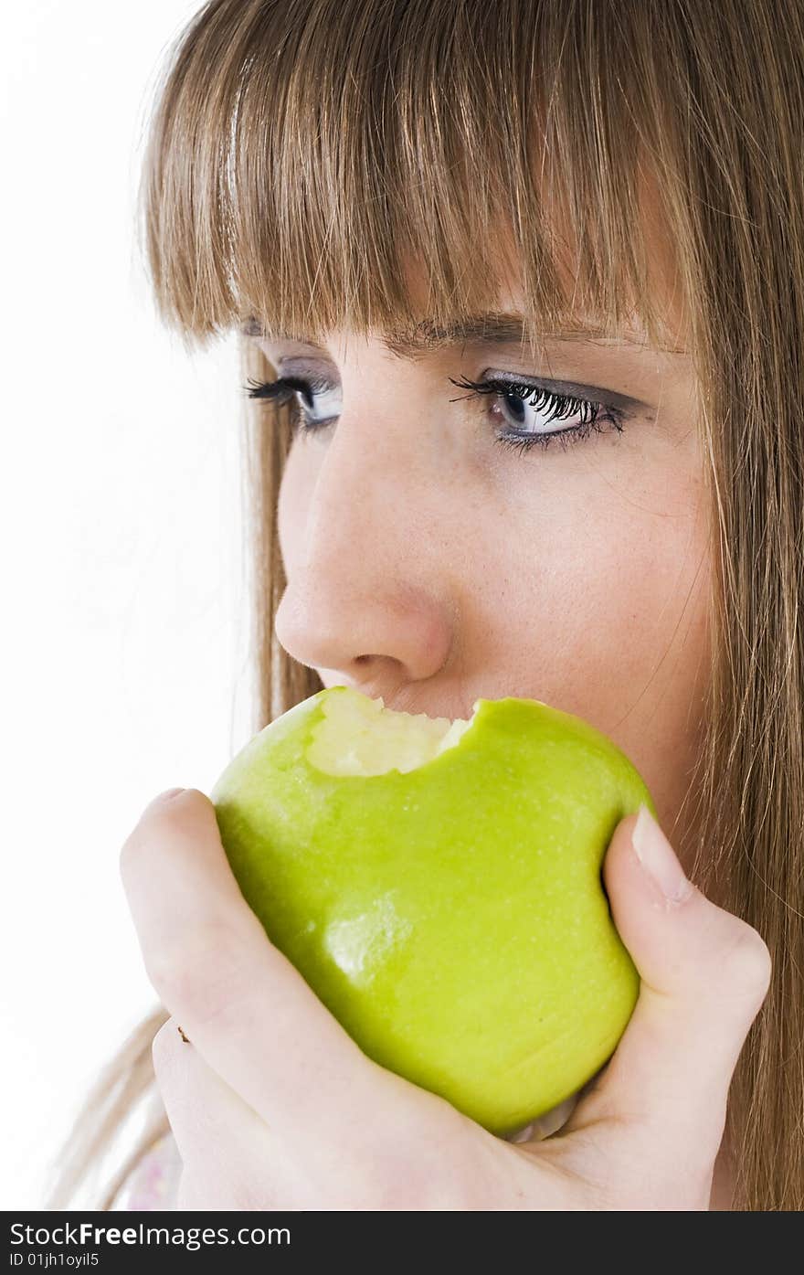 Young blue eyes girl with green apple. Young blue eyes girl with green apple.