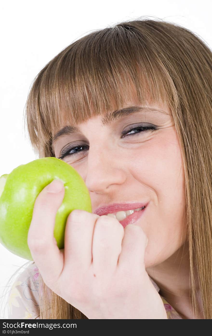 Young blue eyes girl with green apple. Young blue eyes girl with green apple.