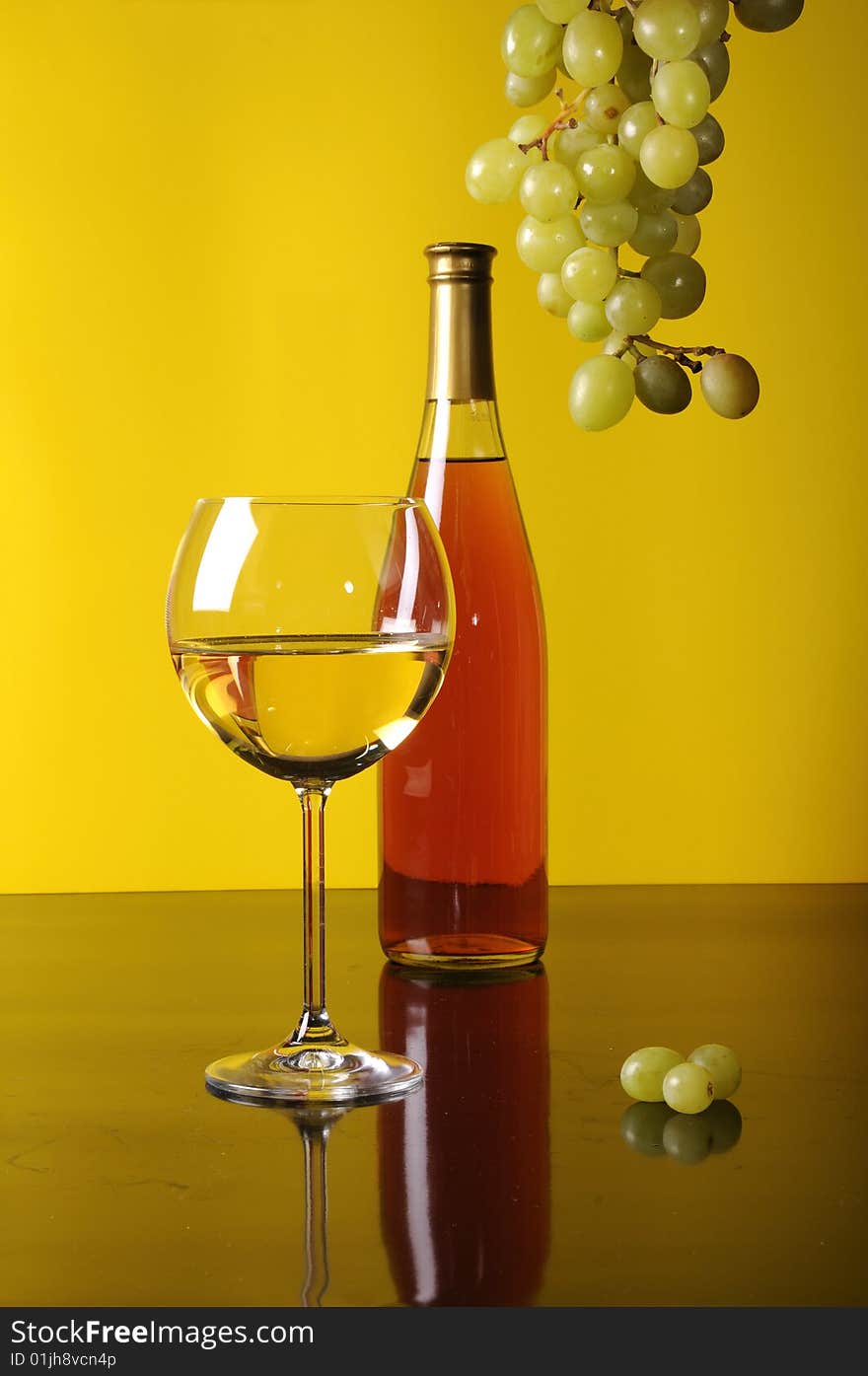 Bottle and glass of wine with grapes. Bottle and glass of wine with grapes