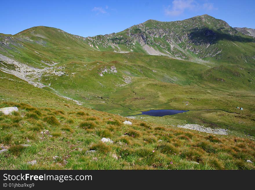 Pond in Carpathian Mountains in Romania (Rodney Mts). Pond in Carpathian Mountains in Romania (Rodney Mts)