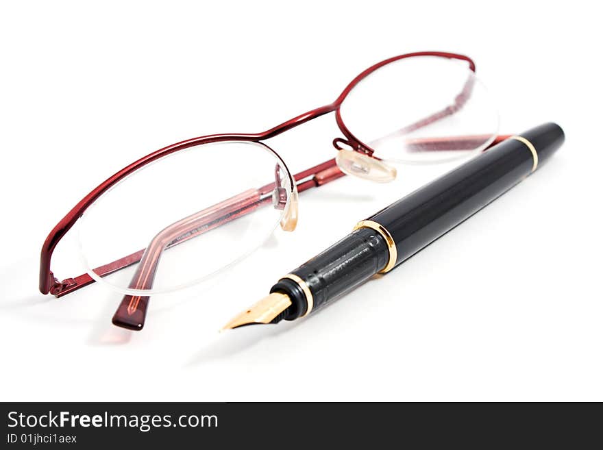 Glass and office fountain pen on white background