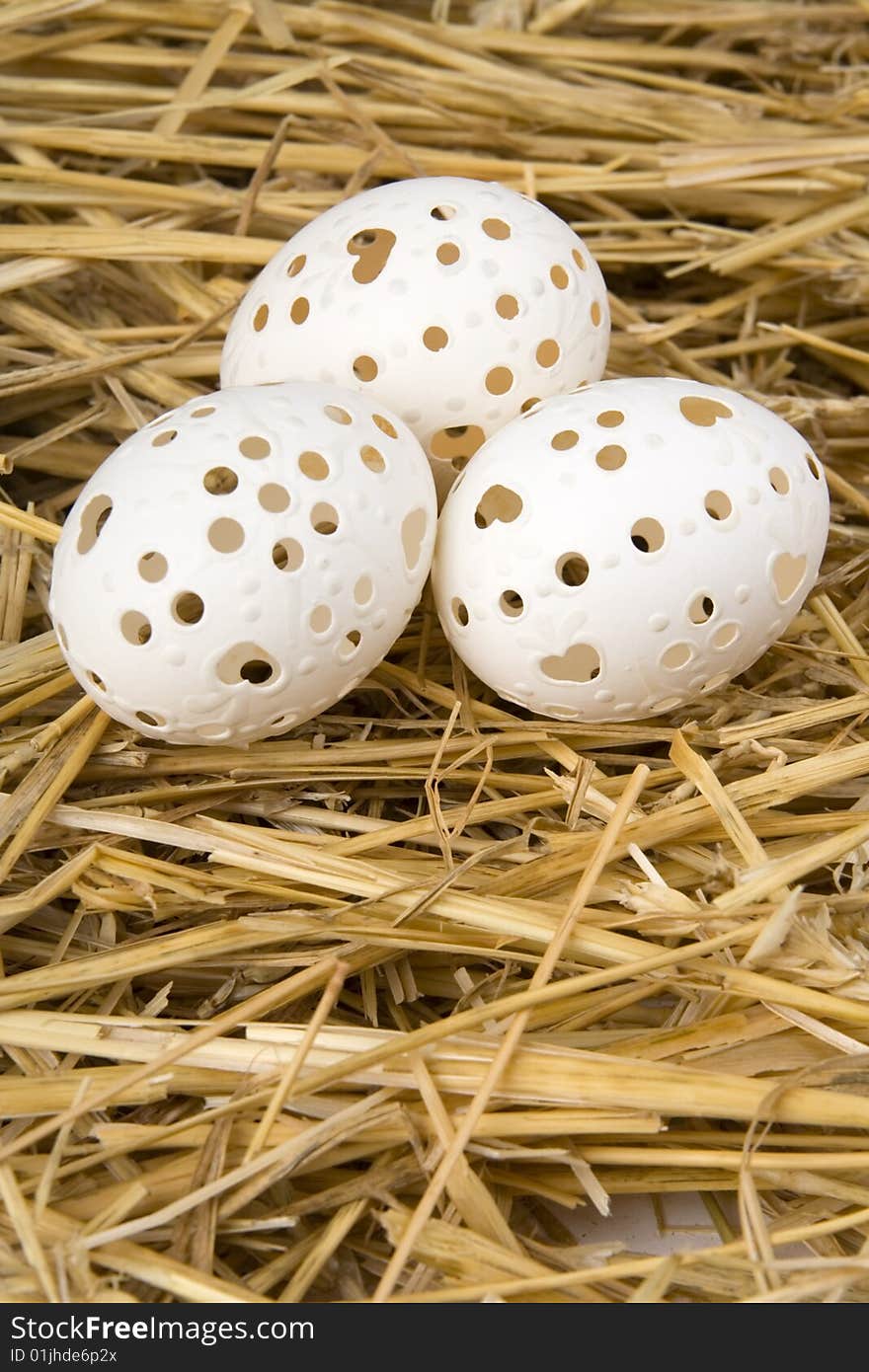 Easter egg against a background from straw.