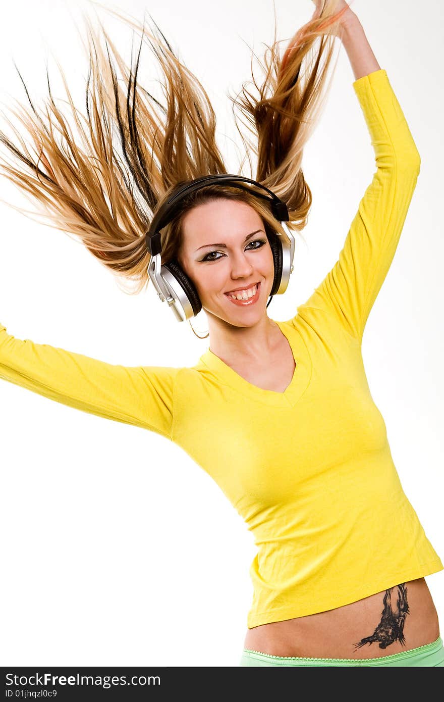 Beautiful blond girl with long hair and headphones. Beautiful blond girl with long hair and headphones