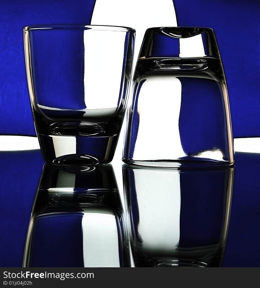 Set of the liquor-glasses on glass surface