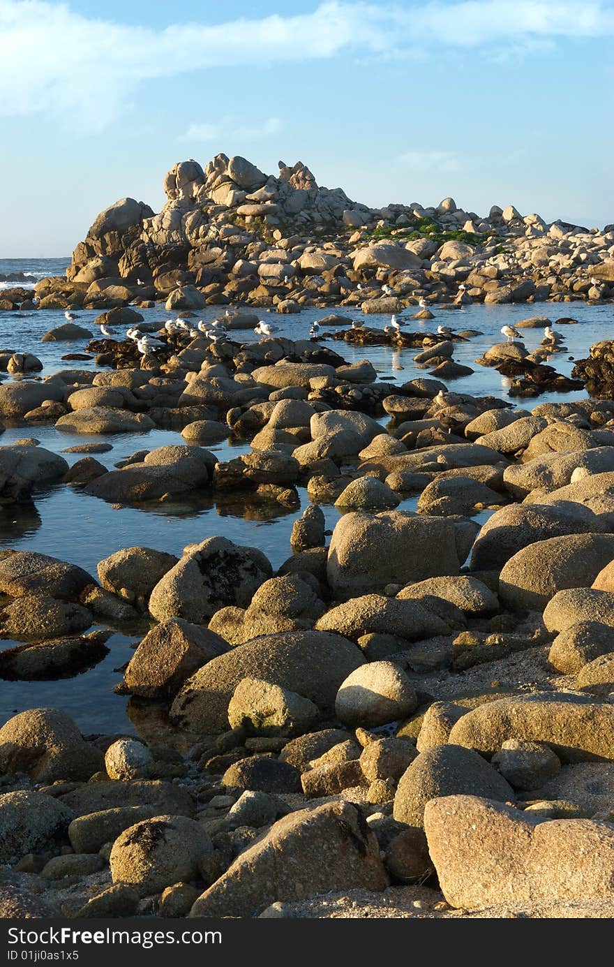 Rock covered island and beach