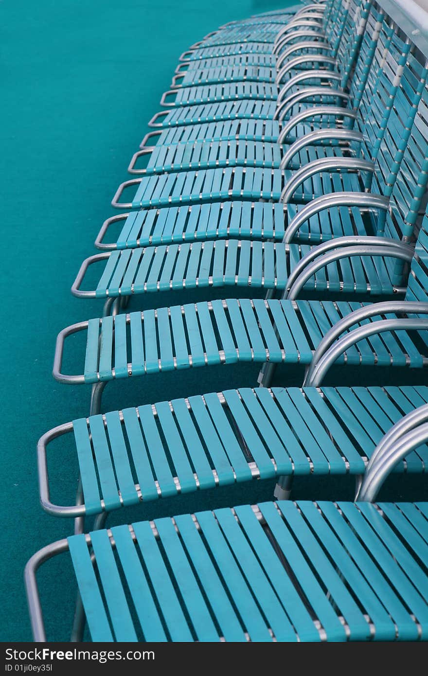 Deckchairs around swimming pool on a cruise ship