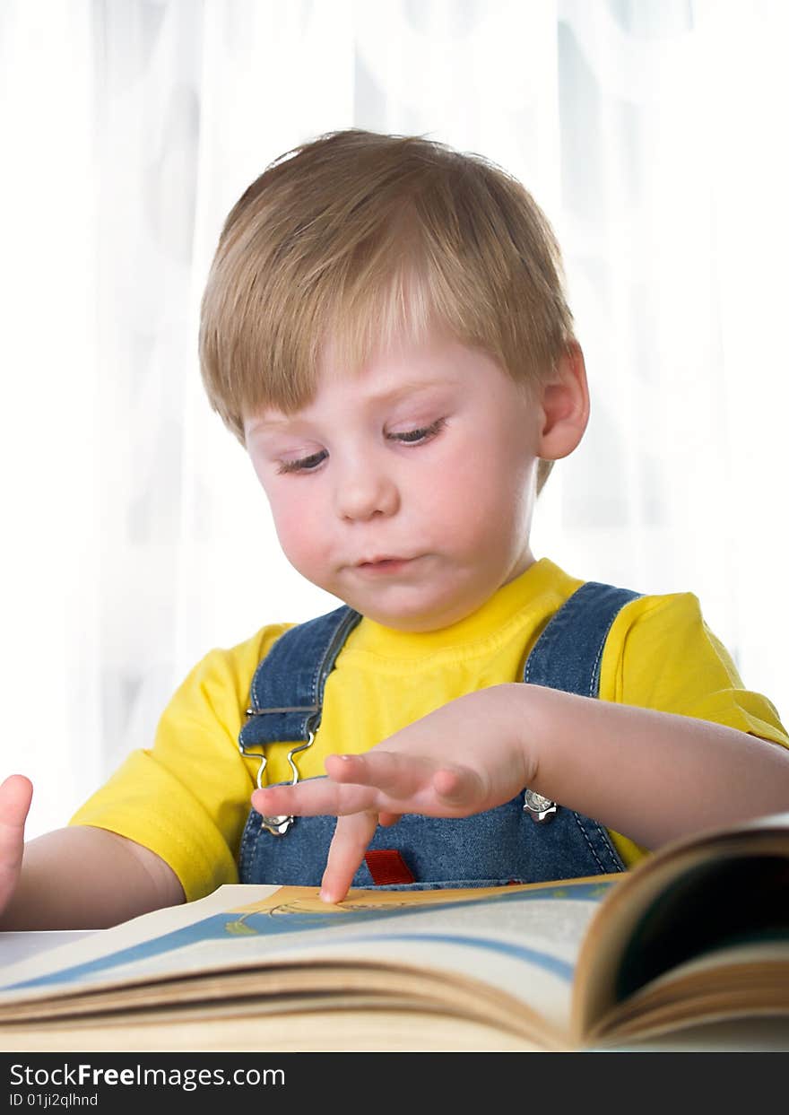 The child with books on the white background