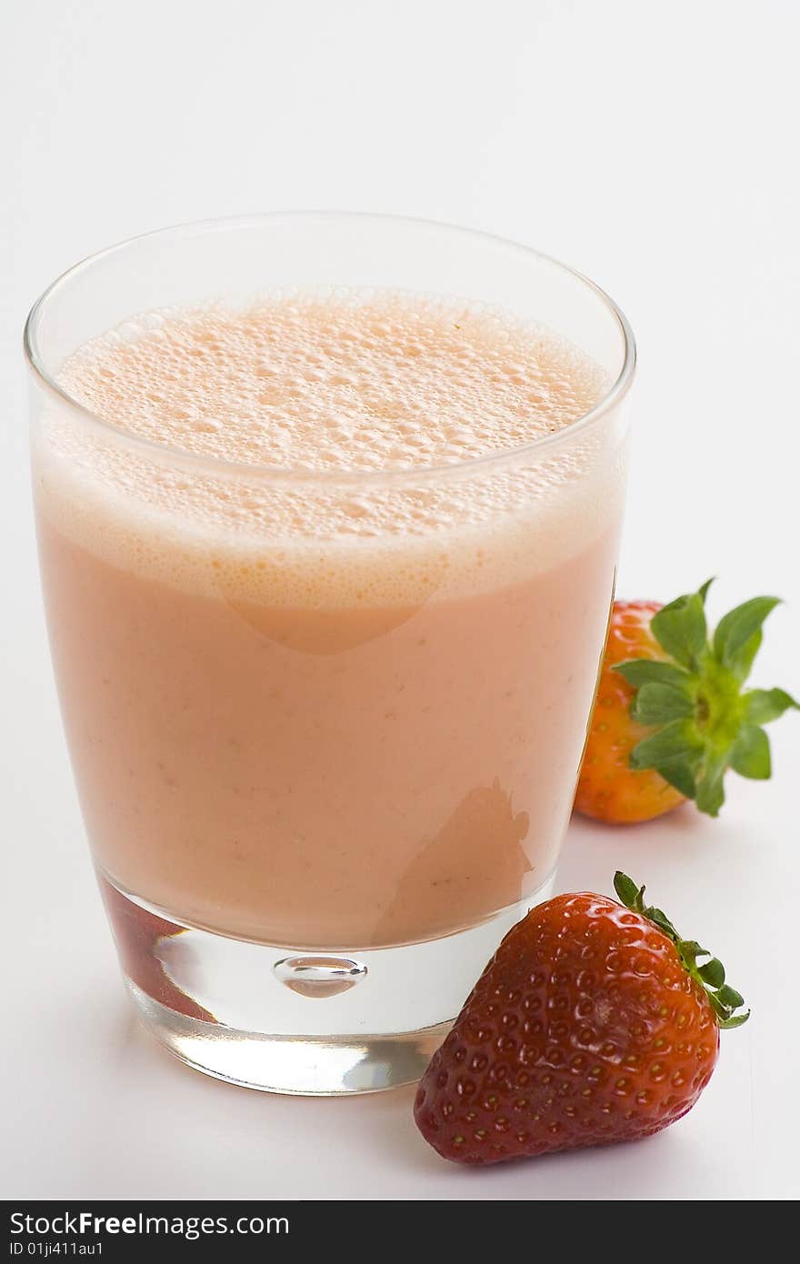 Delicious refreshing strawberry orange banana milkshake natural isolated. Delicious refreshing strawberry orange banana milkshake natural isolated