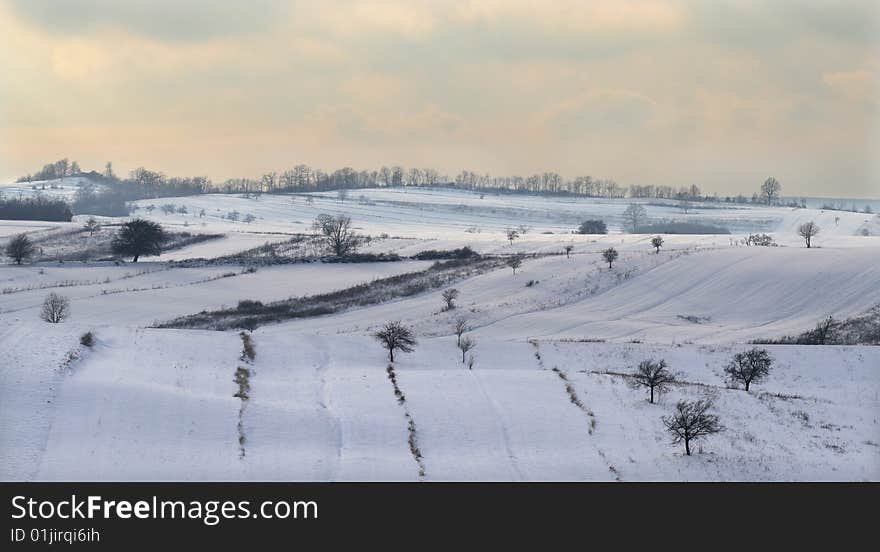 A view over a part of the Romanian countryside in winter. A view over a part of the Romanian countryside in winter