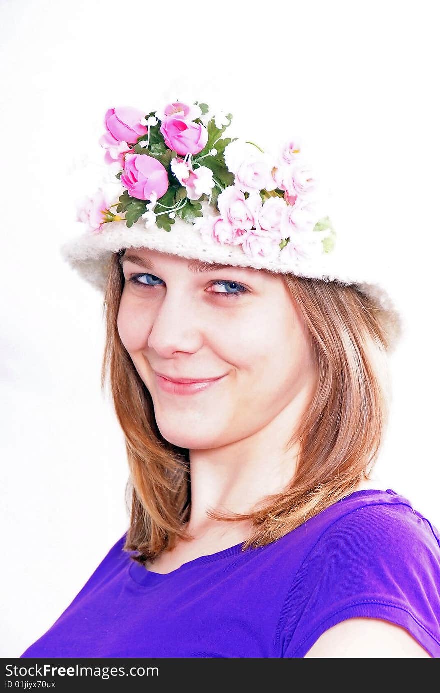 Studioshot of a young beautiful woman wearing an old fashion hat, isolated on white background. Studioshot of a young beautiful woman wearing an old fashion hat, isolated on white background