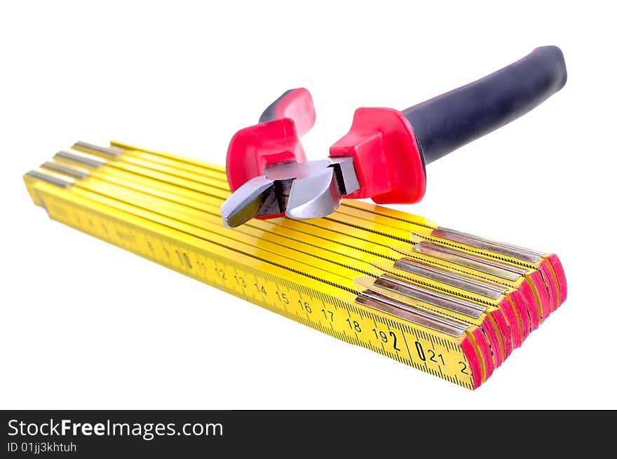 Pliers and meter on the white background. Pliers and meter on the white background