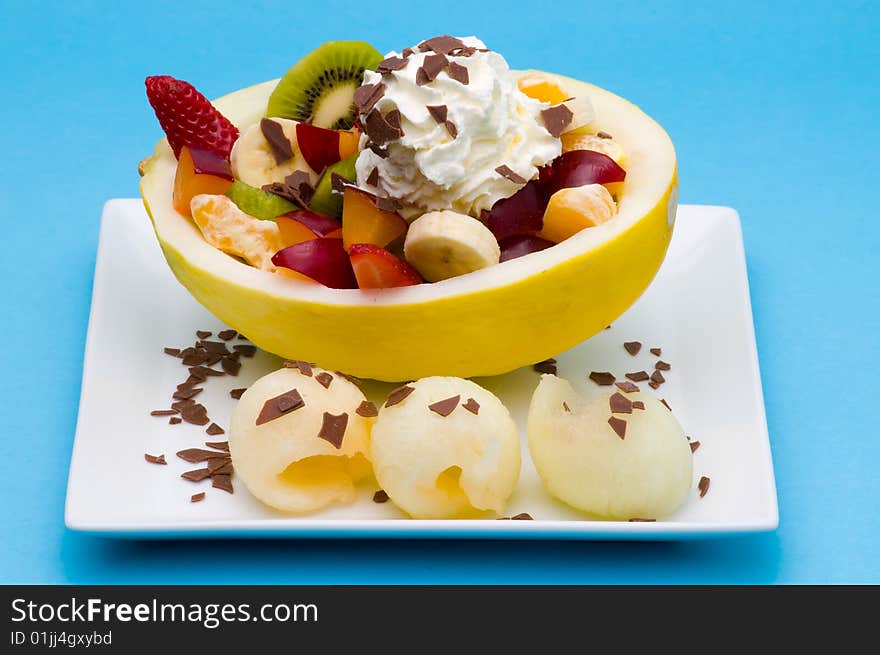 Fruits in a honeydew with cream