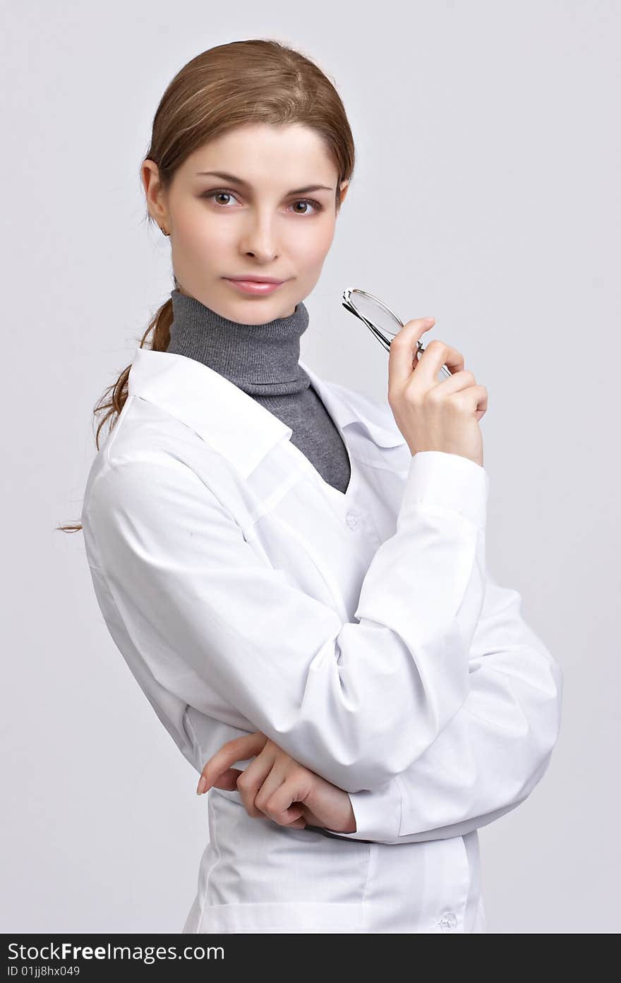 Young beautiful doctor on the white background