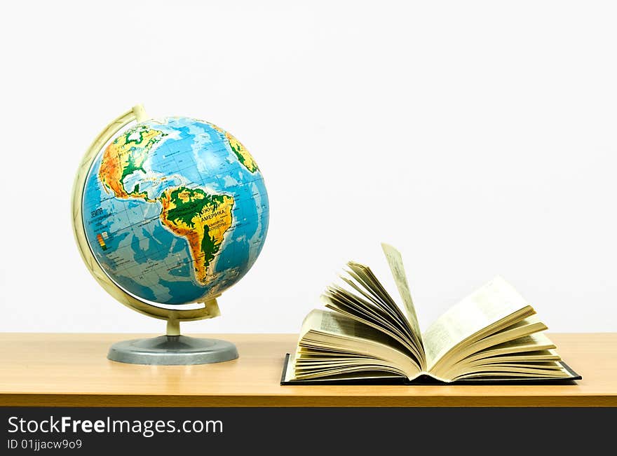 Exposed book and globe