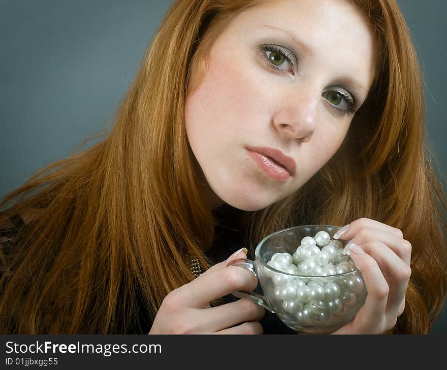 Portrait of beautiful girl with red hair holding cup. Portrait of beautiful girl with red hair holding cup