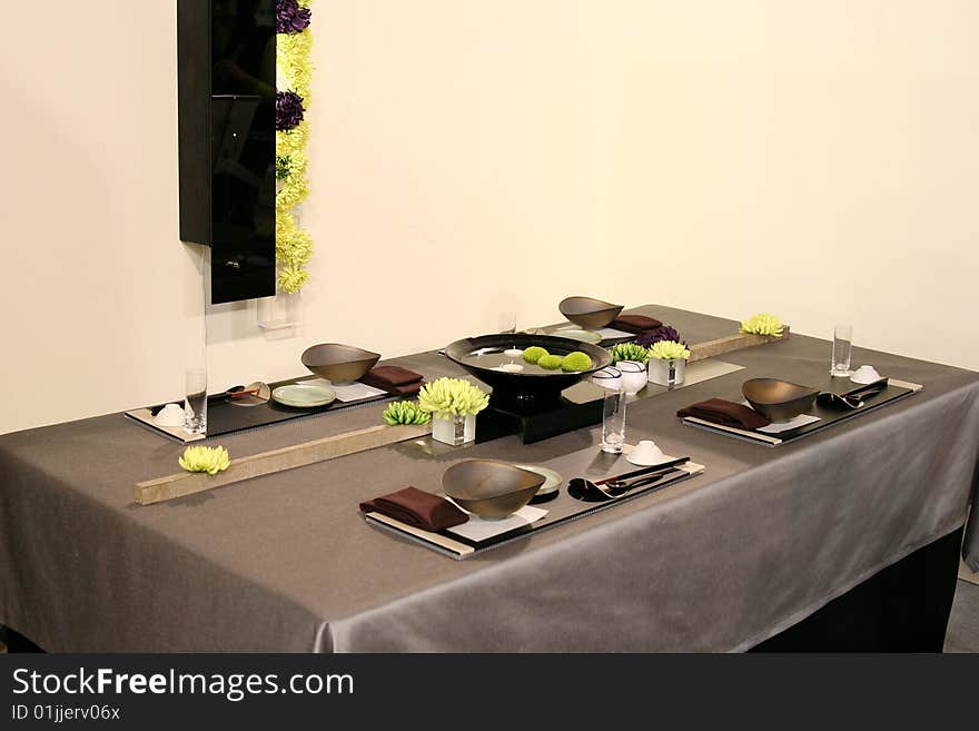 A beautiful table design in Japan. It is consisted of Japan traditional table wares such as dark-color dishes and chopsticks.