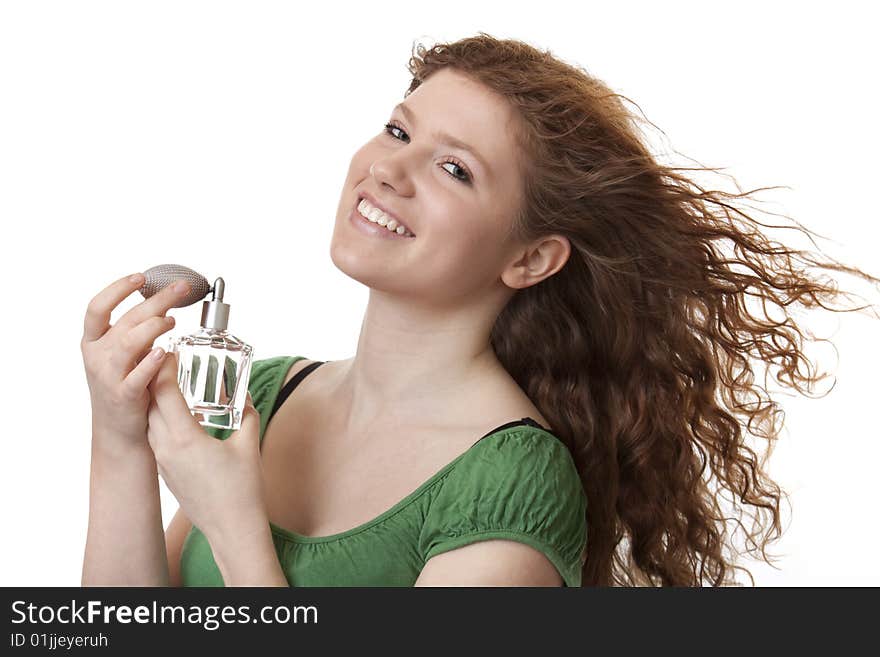 Teenager with perfume, pleasant smell from the bottle