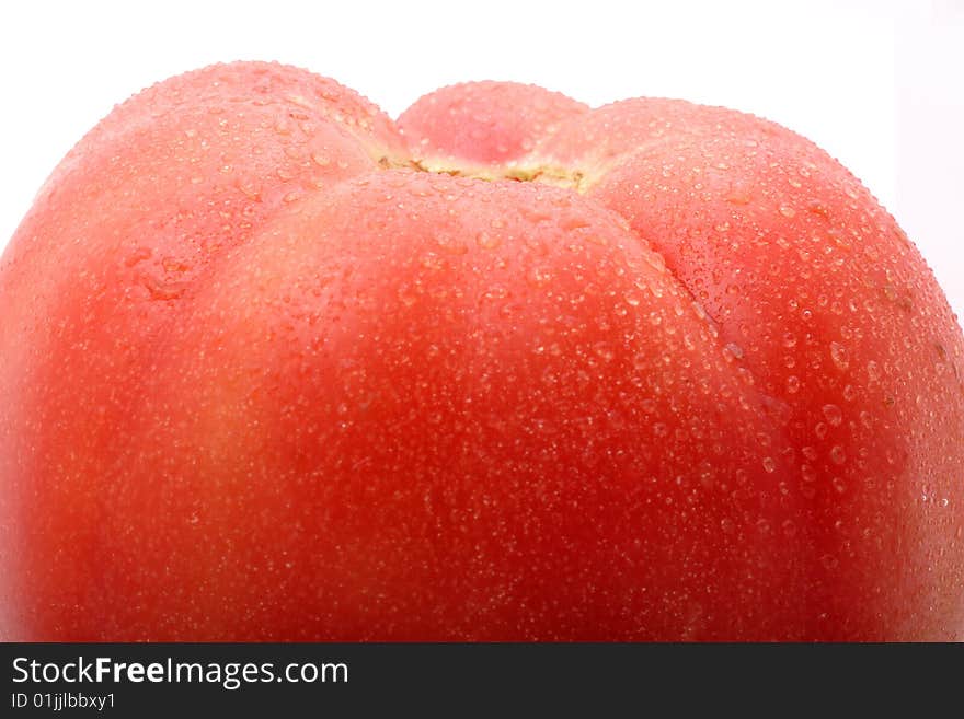 Close-up of a tomato on white background.